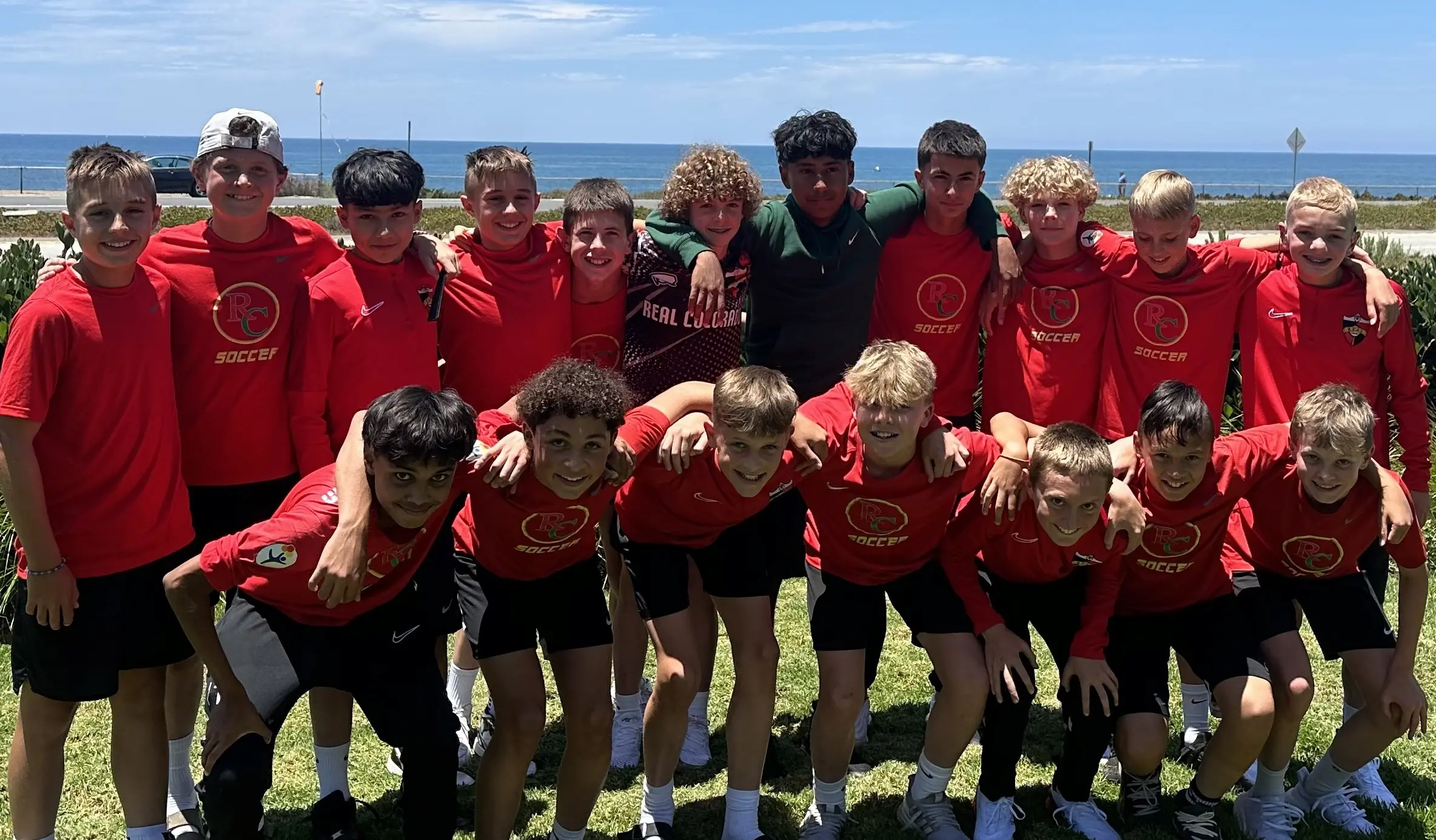 Real Colorado Academy team in white kits under ECNL Elite Clubs National League tent at Del Mar CA June 2024